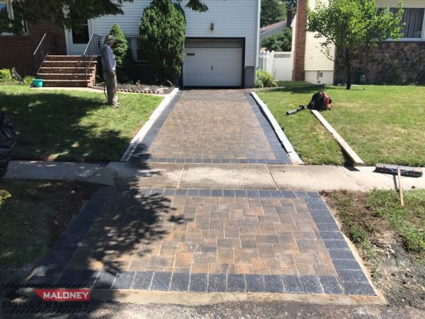 Laying interlock pavers on driveway in Roselle Park, Union County
