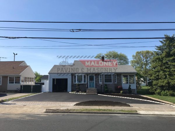Our installation team paving a driveway in Manville, Somerset County